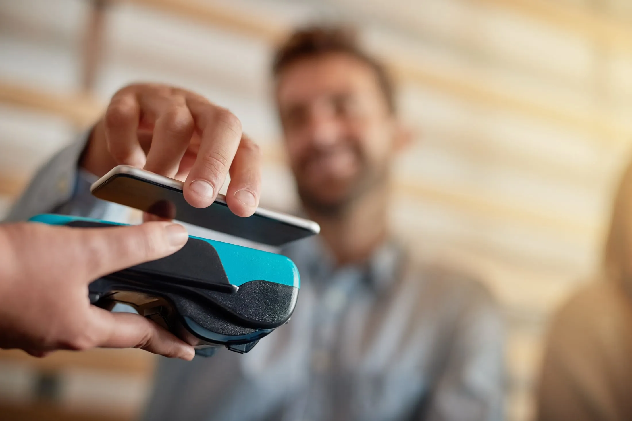 Workers using a digital tablet to coordinate in a warehouse