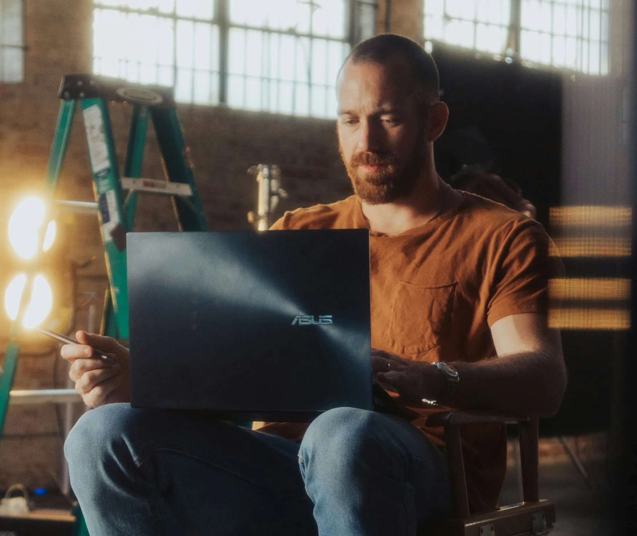 Two people reviewing invoices and calculating costs at a desk